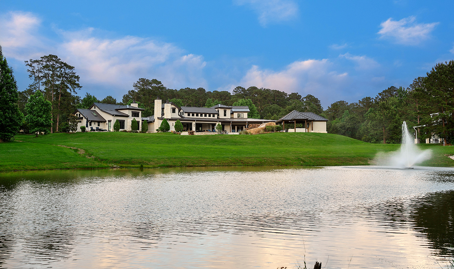 Aerial view of the private pond and grounds at sunset